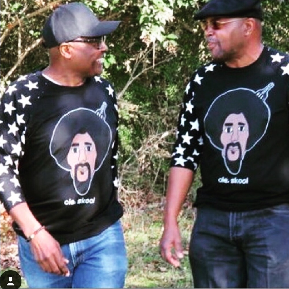 Black men’s tshirt with baseball length sleeves.